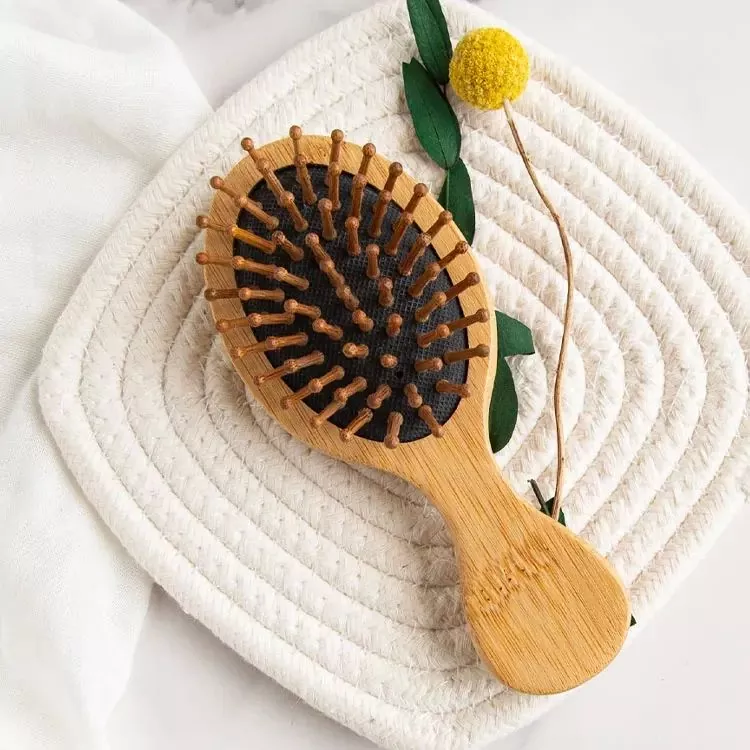 How can a wooden hair brush reduce frizz and static